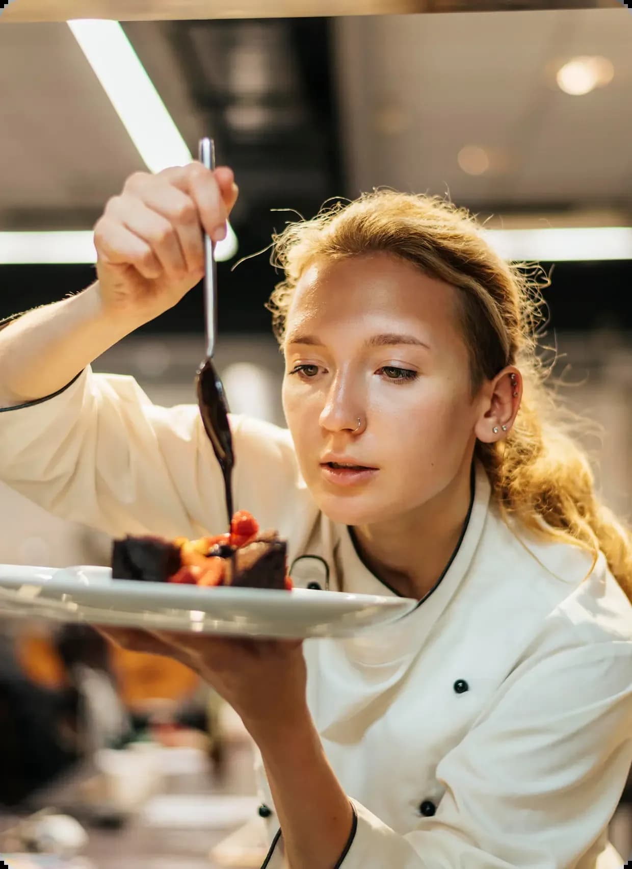 Executive chef garnishing a dish