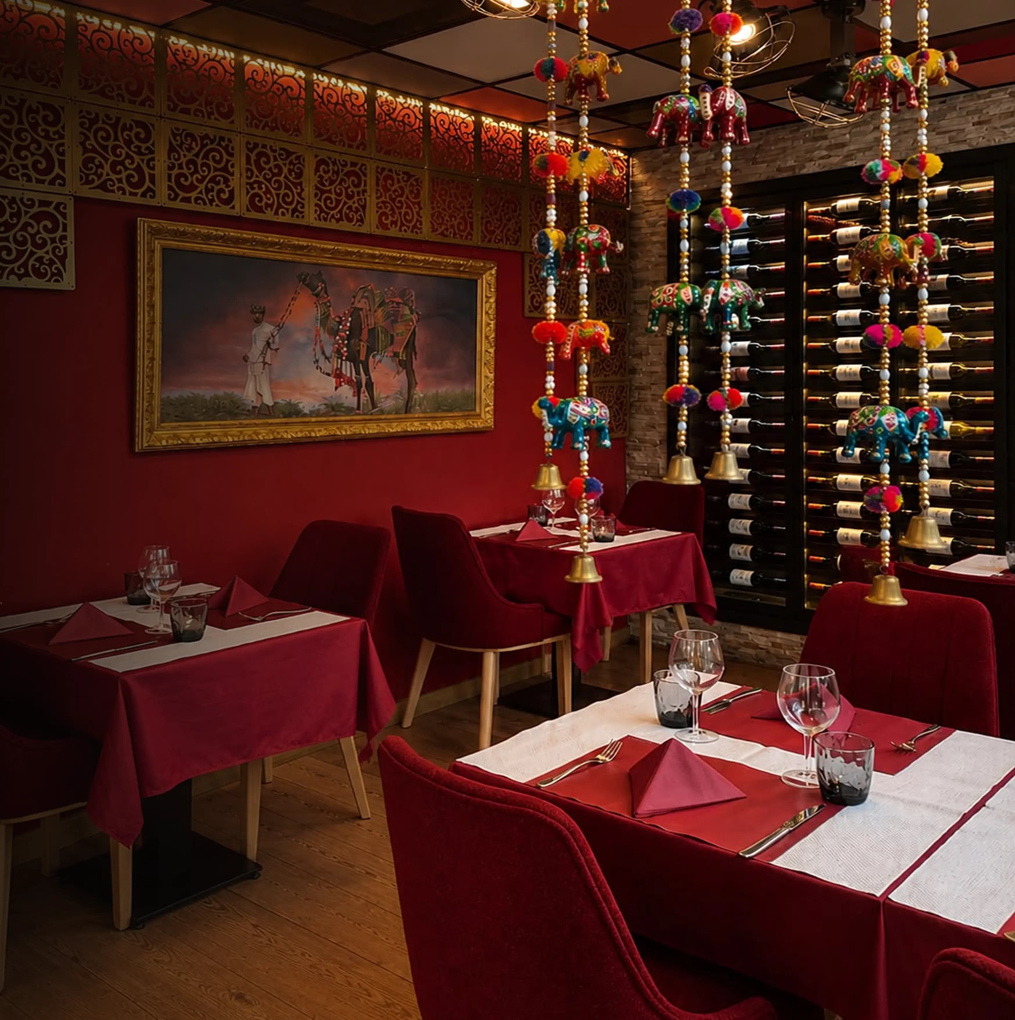 Indian Masala fine dining room with red velvet chairs and traditional décor